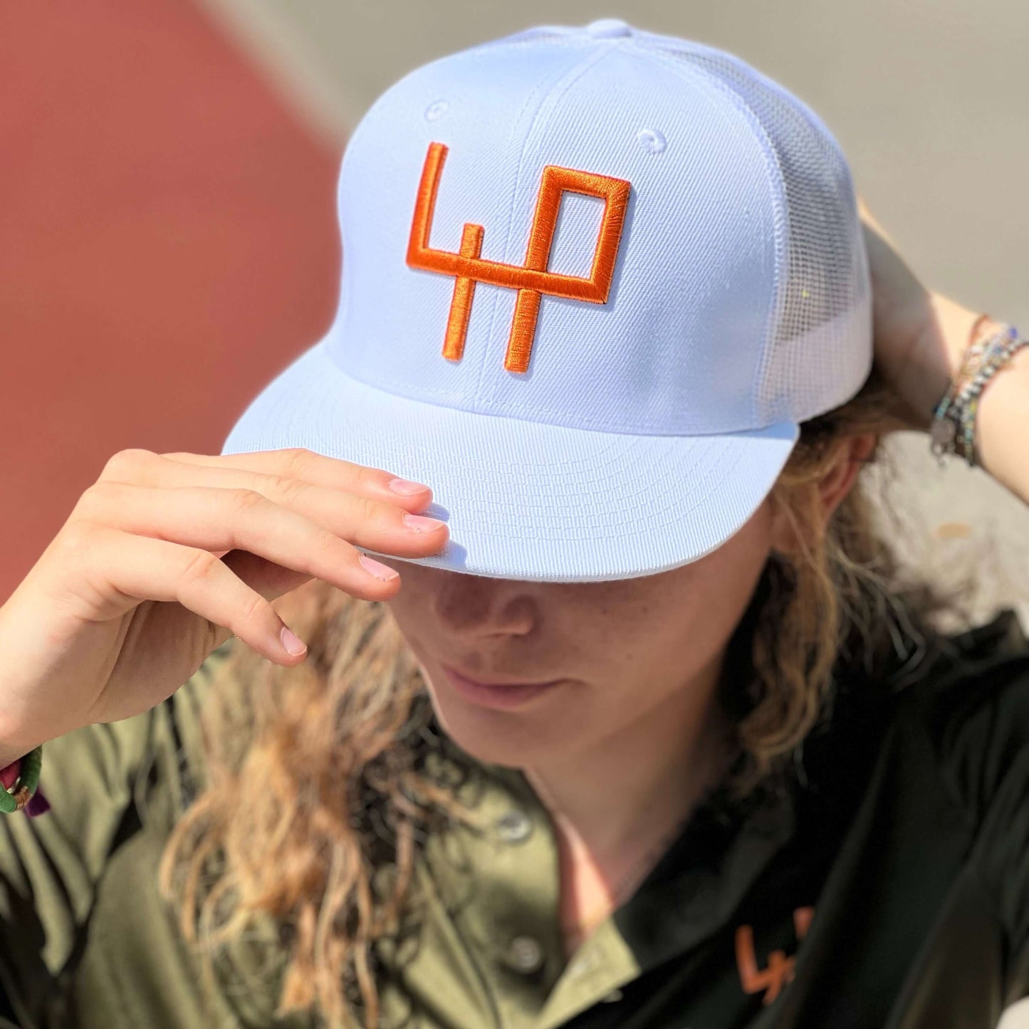 Flat Brim white background Logo in 3D orange color - It's not a brand, it's an attitude!